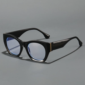 Modern black cat-eye glasses with gold hinge detail and light blue lenses in a side view