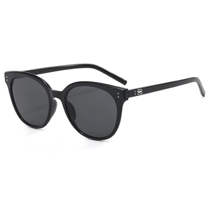 Classic black oversized round sunglasses with vintage frames and silver decorative accents