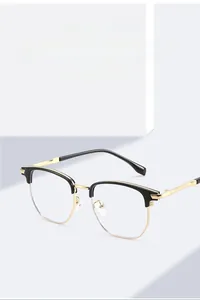 Detailed close-up of TR90 half-rim business glasses with black and gold metal frame