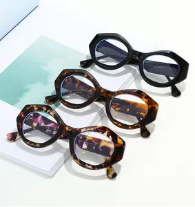 Detail showing irregular geometric frames in black, tortoiseshell and mottled patterns