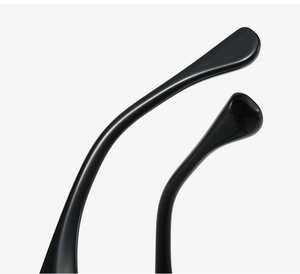 Macro shot of smooth black glossy temple tips for women's oval sunglasses
