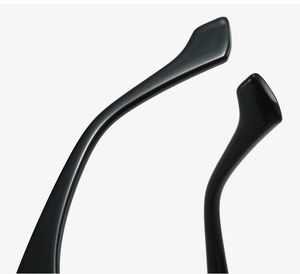 Macro detail of ergonomic glossy black sunglasses temple tips for comfortable fit