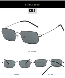 Detail of ultra-light screwless metal sunglasses with rectangular dark grey lenses