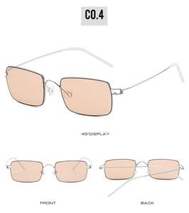 Detail view of screwless silver metal sunglasses with light orange lenses and silicone tips