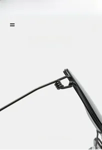 Close-up of lightweight screwless elastic hinge on matte black metal frame sunglasses