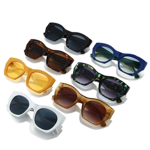 Retro cat eye thick frame sunglasses in seven assorted colors on white background