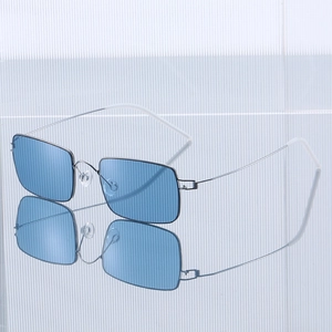 Ultralight screwless rectangle sunglasses with silver metal frame and light blue lenses