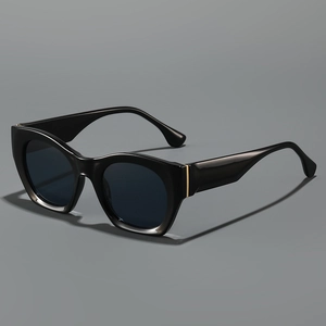Chic black cat eye sunglasses for women with thick frames and gold metal accents