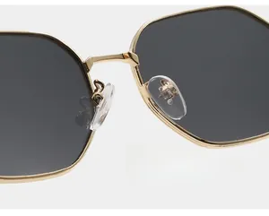 Macro detail of comfortable eco-friendly nose pads on gold metal frame sunglasses