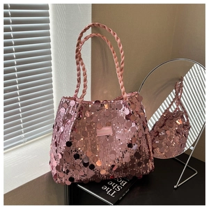 Detail of pink sequin tote bag with woven handles and Fashion & Bags leather patch