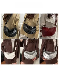 Collage of models wearing trendy crescent crossbody bags in black, burgundy, white and silver