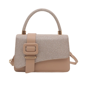 Elegant nude crossbody bag with glitter fabric stitching and a large square buckle detail