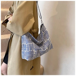 Detailed view of the blue and white geometric pattern on the canvas tote shoulder bag