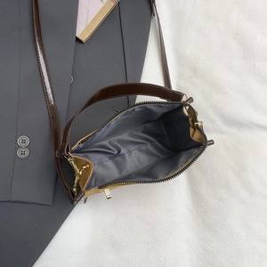 Brown quilted box bag with spacious interior for work, retro crossbody handbag style