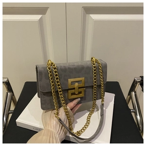 Close-up of grey leopard print crossbody bag with chunky gold chain and metal buckle