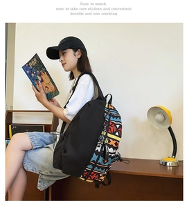 Detail of backpack side with colorful geometric ethnic patterns and durable black fabric
