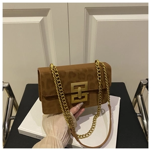 Close-up of leopard print square crossbody bag with gold geometric buckle and chain strap
