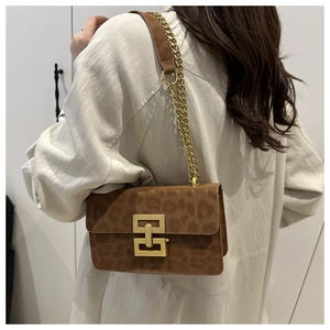 Brown leopard print shoulder bag with gold chain strap and metallic lock on the flap