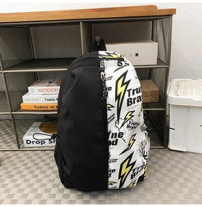 Close-up of waterproof nylon backpack featuring graffiti lightning print and dual zippers