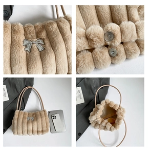Detail view of plush faux fur handbag with silver metal bow and magnetic closure