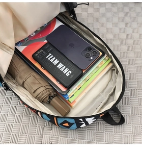 Interior view showing the large capacity of the geometric pattern backpack with multiple items