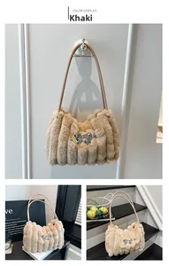 Detail of khaki plush handbag featuring a silver mirror bow and faux fur texture
