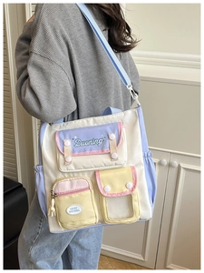 Detailed side view of multi-color crossbody bag with adjustable strap on model