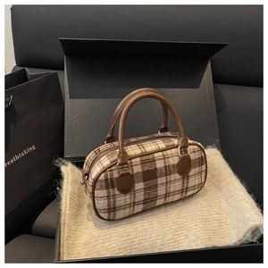Detail of checkered plaid Boston bag in premium gift box with knit blanket texture