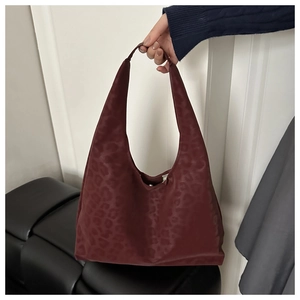Detail of burgundy leopard print hobo bag in matte material with large capacity