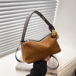 Chic caramel brown suede tote bag with a gold chain and dark coffee leather straps