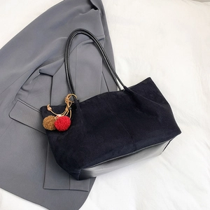 Retro black large tote bag in mixed matte finish with plush pompom charm detail