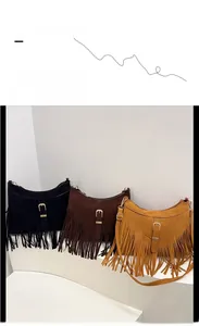 Detailed view of three tassel suede crossbody bags in black, dark brown, and ginger colors