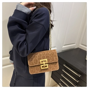 Brown leopard print suede flap bag with gold chain strap and metallic lock buckle