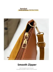Detail of smooth gold zipper and luxury leather texture on the fringe tote bag