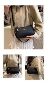 Close-up of black lychee grain leather underarm bag with gold metal buckle and logo