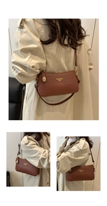 Detail view of brown pebble leather handbag with gold logo and adjustable shoulder strap