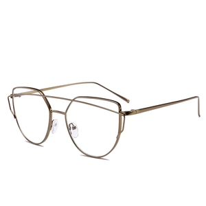Close-up of bronze cat-eye metal eyeglasses frame with double bridge design on white background