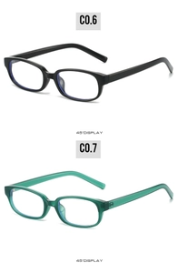 Detail view of square eyeglass frames in black and translucent green from a 45-degree angle