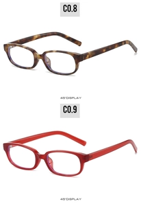 Detailed 45-degree view of tortoiseshell and bright red rectangular eyeglass frames