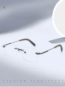 Close-up of rimless business eyeglasses with gunmetal frame and blue light blocking lenses