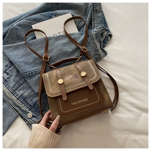 Detail of vintage canvas mini square backpack with leather trim and tidal dryness print