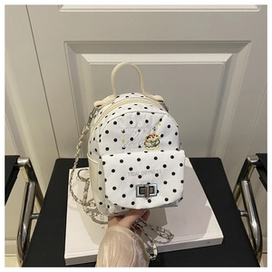 Detailed view of polka dot mini bag featuring hamburger embroidery and chain strap