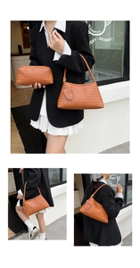 Detail of woven leather shoulder bag and pouch set in brown orange with a classic texture