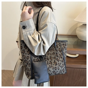 Fashion leopard print tote bag with black shoulder straps and small zipper pouch accessory