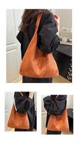 Detail of caramel suede hobo tote bag showing soft matte texture and large capacity
