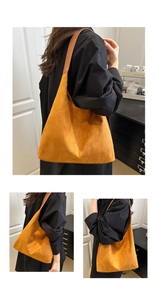 Detail of a large yellow suede hobo tote bag with soft leather strap for daily commuting