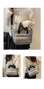 Close-up of silver quilted tote bag with contrasting monochrome wide shoulder strap detail