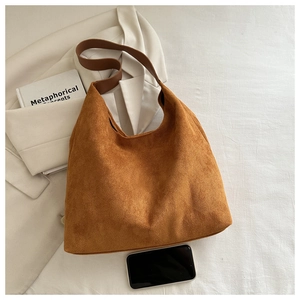 Brown hobo shoulder bag in premium suede with a spacious interior for a smartphone