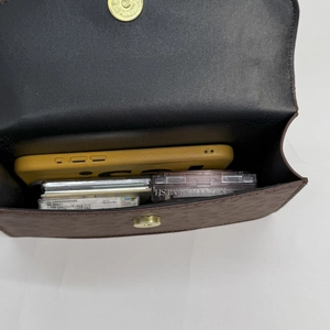 Brown leopard print square bag interior showing capacity for phone and cosmetics