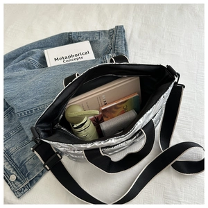 Silver quilted tote bag interior view showcasing large capacity for daily essentials